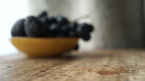 Someone putting an glass on a table Stock Footage 232400409