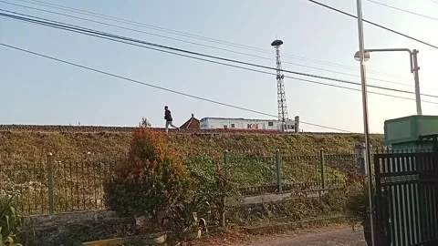 Someone is running alongside the train... Stock Footage 242911525