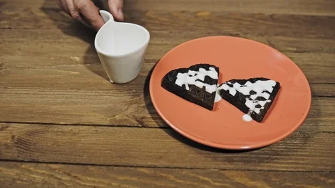 Someone serves Breakfast, watering white sauce heart waffles. Stock Footage 101838340