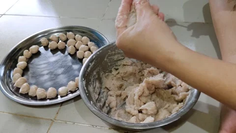 Someone shapes minced meat into small meatballs Stock Footage 304048449