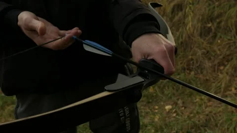 Someone is shooting a bow 스톡 동영상 220906364