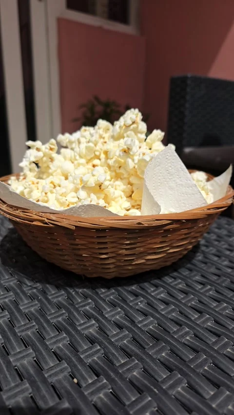Someone spills a mountain of popcorn Stock Footage 307220426