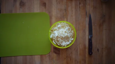 Someone sprinkles chopped cabbage with ground pepper. Stock Footage 104727293
