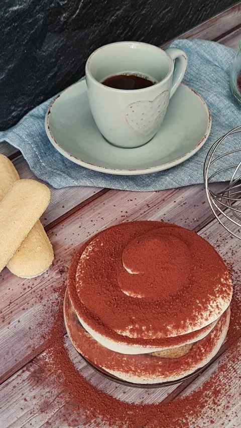 Someone sprinkles cocoa while making tiramisu Stock Footage 306961900