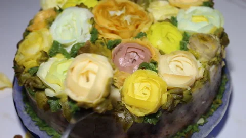 Someone steals a rose from the cake. Imitations of handmade rose and Ranunculus Stock Footage 143675015