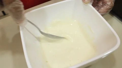 Someone stirs the flour mixture Stock Footage 334268450