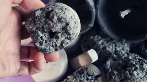 Someone takes out a multi-layer drill samples from the inside of the crown for d Stock Footage 128829161