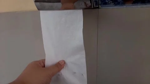 Someone takes a tissue from the box, pulls out the tissue Stock Footage 284442262