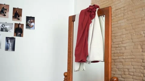 Someone is throwing clothe at the mirror Stock Footage 147899435