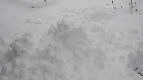 Someone throws snow into a pile Stock Footage 122505495