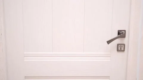 Someone is trying to open the door close up. Handle door twitches. Someone is Stock Footage 242100585