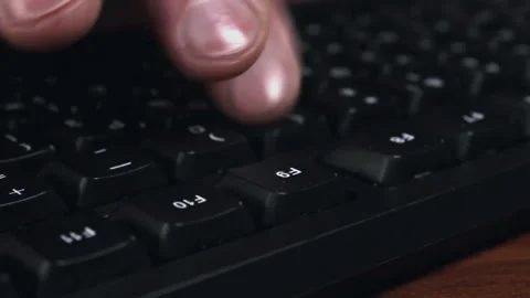 Someone typing on computer, fingers and black keyboard close up Stock Footage 204818777