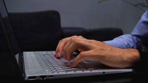 Someone typing on a modern, gray computer keyboard Stock Footage 149282729