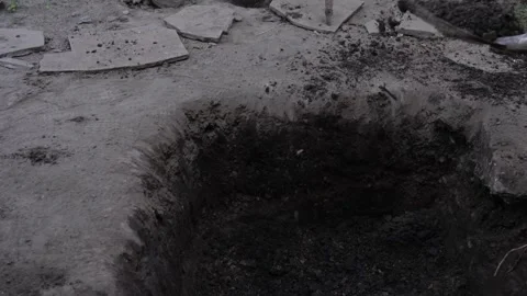 Someone unknown person is digging me a dark black and white scary video. The Stock Footage 313877355