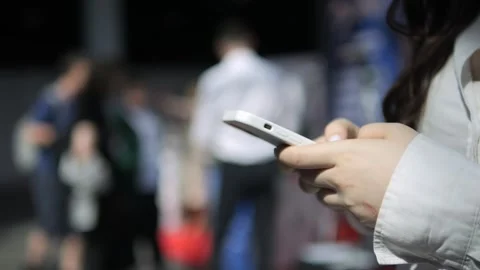 Someone uses phone with green screen while relaxing in park 스톡 동영상 310788124