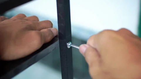 Someone using a screwdriver Stock Footage 325352874