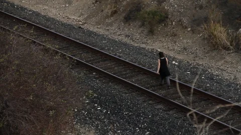 Someone walking on train tracks Stock Footage 83135541