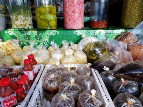 Someone was picking mango pickled in a bag. Stock Photos
