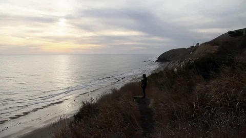 Someone watching the sunset Stock Footage 83137931