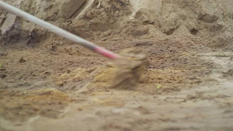 Someone who level the sand with a rake Stock Footage 131061822