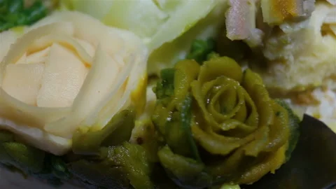 Someone will remove a green rosebud with a spoon. Confectionery Floristics, edib Stock Footage 143597482