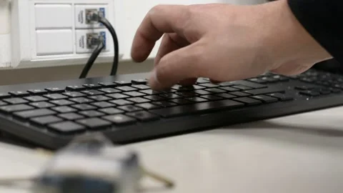 Someone work on black keyword low angle view selective soft focus Stock Footage 170151928