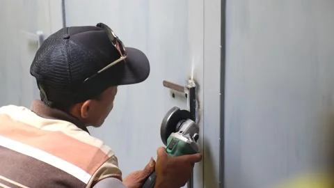 Someone's activity is smoothing the iron surface with a machine Stock Footage 238648636