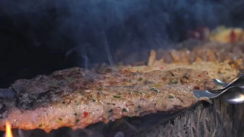 Someone's frying a kebab. Stock Footage 132310985