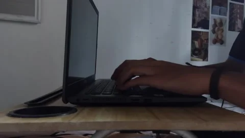 Someone's hand typing on a laptop Stock Footage 229705196