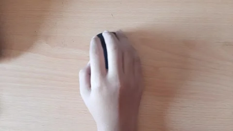 Someone's hand using a wireless mouse Stock Footage 296167738