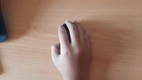 Someone's hand using a wireless mouse Stock Footage 296167743