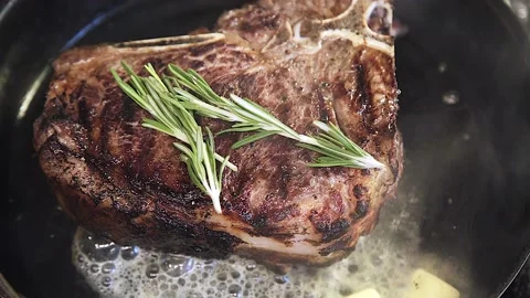 Someone's making steak Stock Footage 130988808