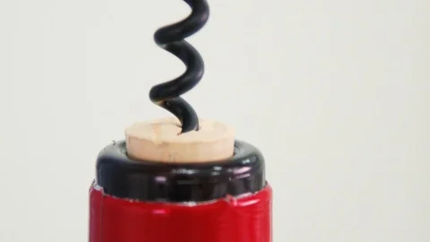 Someone's opening up a bottle of corkscrew wine. Stock Footage 114121684
