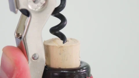 Someone's opening up a bottle of corkscrew wine Stock Footage 114121703