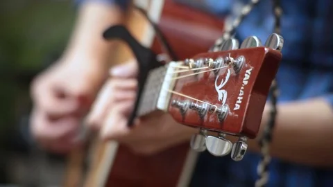 Someone's playing the guitar with capodastre Video stock 121404151
