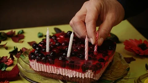 Someone's putting the candles in the cake Stock Footage 113523612