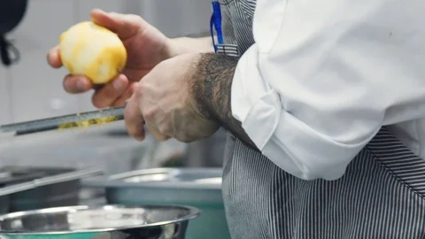 Someone's rubbing a lemon rind. Stock Footage 114229940