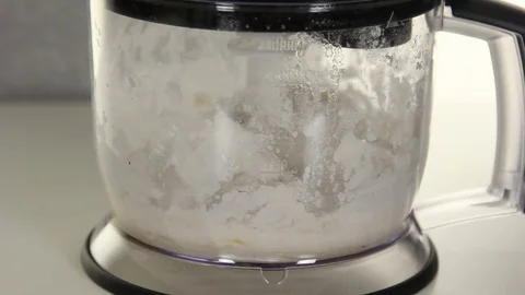 Something white is mixing in the blender Stock Footage 69911379