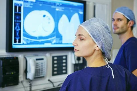 Sometimes you cant help but to get attached...two surgeons in a operating room. Stock Photos