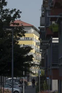 A somewhat blurry picture featuring a building that has a red roof Stock Photos