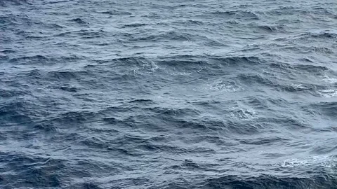 Somewhat rough open seas on a clear day water background with copy space Stock Footage 105072562