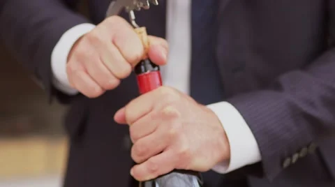 Sommelier opening wine bottle 스톡 동영상 56030757