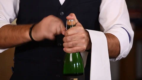 Sommelier opens a bottle Stock Footage 113050516