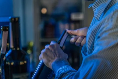 Sommelier opens a bottle of wine in the restaurant Stock Photos