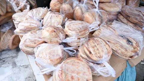 Somun, traditional flat bread in Turkey. Fresh bread for sale Stock Footage 296103787