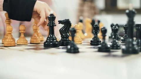 Son and father playing chess Stock Footage 86654411