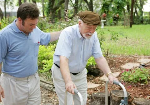 Son &amp; Elderly Father Stock Photos