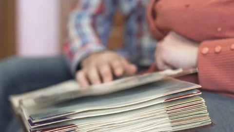 Son with an elderly mother watching old photo album Stock Footage 101683761