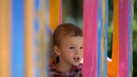 Son with mom riding a child's train. Stock Footage 76283958