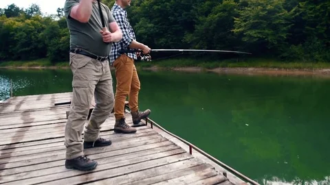 Son screw with father while fishing Stock Footage 80907911